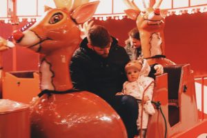 Molly and daddy on the reindeer ride