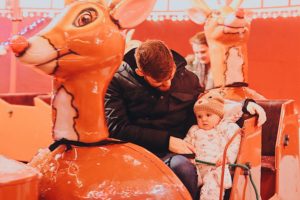 Molly and daddy on the reindeer ride