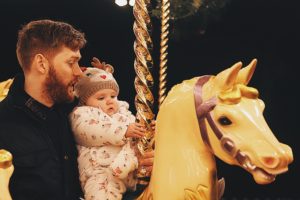 Having fun on the rides with Daddy