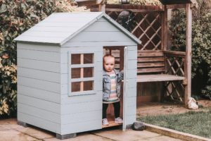 Molly playing in her playhouse