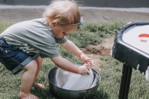 perfecting her pouring skills